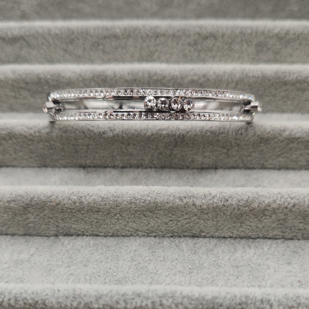 Elegant Silver Toned Stainless Steel Bangle Bracelet with Movable Zircon Accents